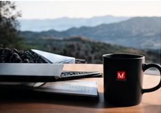 Mug and journal on desk